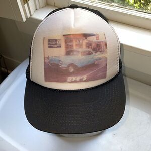 Vintage black & white trucker hat with picture of Dye’s blue ‘57 Chevy on it